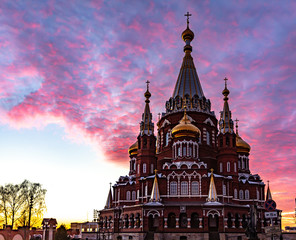 Church on the background of a beautiful sunset. Easter holiday for Christians