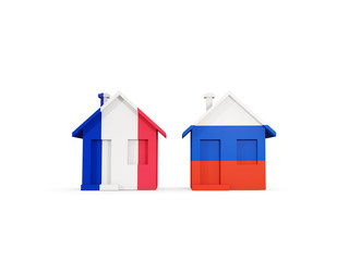 Two houses with flags of France and russia