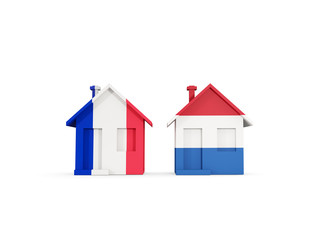 Two houses with flags of France and netherlands