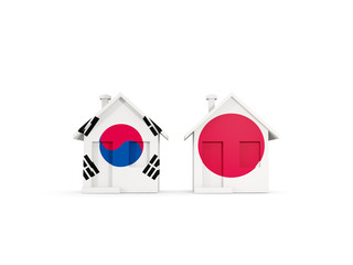 Two houses with flags of South Korea and japan