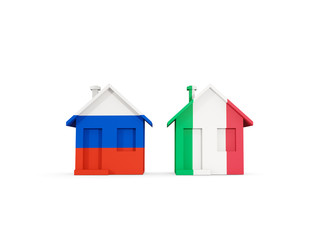 Two houses with flags of Russia and italy