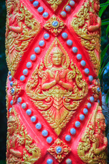 Golden angel craved in act paying respect to welcome to the public Buddhist temple. Thai style crafted golden angel is acting Wai or Sawasdee. Sawasdee is the word to use for greetings and goodbye.