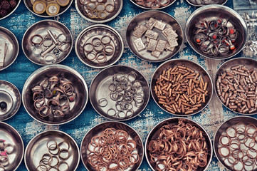 Different plates with various metal objects close up
