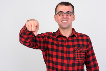 Fototapeta premium Portrait of happy hipster man pointing at camera