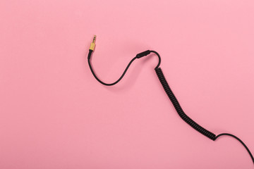 black wire isolated on a pink background abstraction