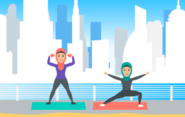 two arab muslim women exercising training outdoor urban background