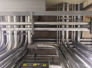 Full of galvanized steel conduits and Pull box for cable wiring joint with electrical box on cement ceiling at Main Distribution Board room.