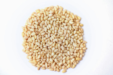 Bunch of Roasted cedar nut  on white background