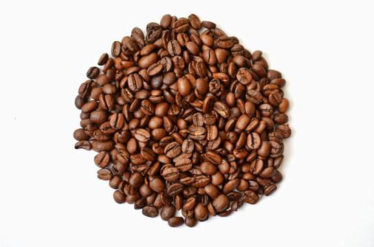 Bunch of Roasted coffee beans  on white background