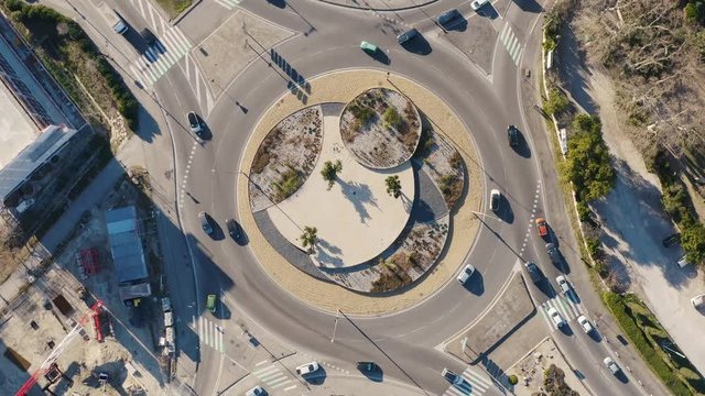 Aerial drone view of a roundabout with traffic France circular camera movement 