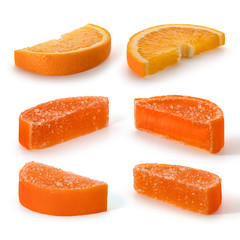 Marmalade candy and orange slices on a white background