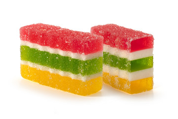 Marmalade candy with multi-colored layers on a white background