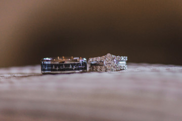 White gold wedding rings with diamonds on white pillow