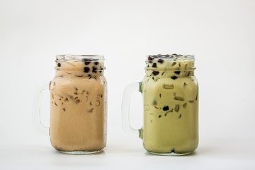 Glass of Iced milke tea and Iced milk green tea with bubble boba the fresh cold drink on white background 
