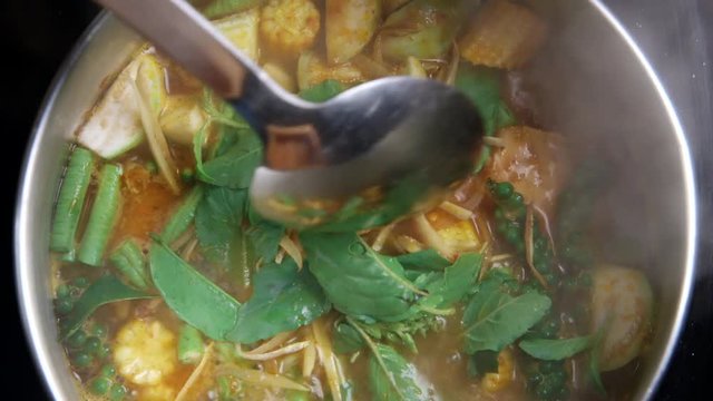 cooking Thai Curry with salmon fish and vegetable