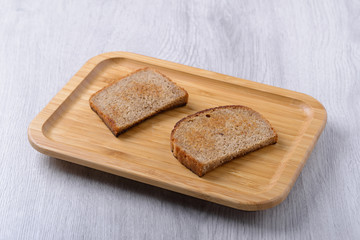 toast on a wooden plate