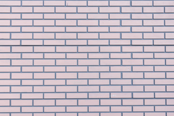 empty soft pink brick wall textured background.