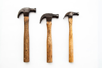 Set of three vintage old hammer on white background, tool for carpenter wood working 