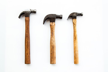 Set of three vintage old hammer on white background, tool for carpenter wood working 