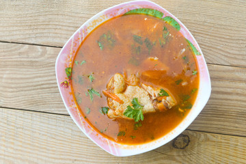 Ukrainian and Russian beetroot soup - borscht with chicken meat on wooden table. Top view