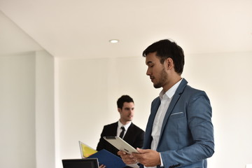 A group of young business people are meeting and having fun talking. And sometimes stressful