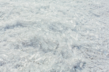 Amazing abstract broken ice crystals texture. Clear melting ice background.