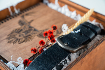 man's gift with a notepad made of wood and a belt