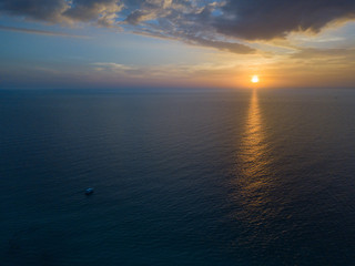 Beautiful sunset time boat the on sea , tranquil scenic nature background