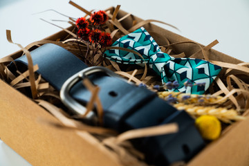 wrapped gift, bow tie and belt, gift for man