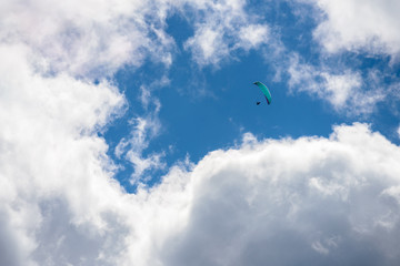 parachute action activity ,cloud blue sky at Dolomite Alps, Italy
