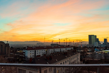 Sunset over a construction site with 16 cranes in the south of Vienna