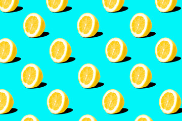 Fresh lemon (lemons) pattern on blue background. Minimal concept. Summer minimal concept. Flat lay