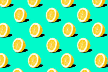 Fresh lemon (lemons) pattern on turquoise green background. Minimal concept. Summer minimal concept. Flat lay