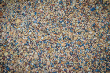 Small black and orange stone gravel background texture. Multicolor gravel textures, mix color of gravel texture for background.