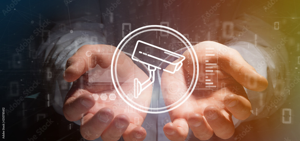 Poster businessman holding security camera system icon and statistics data - 3d rendering