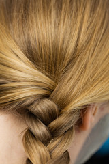 Fototapeta premium Closeup of woman blonde braided hair