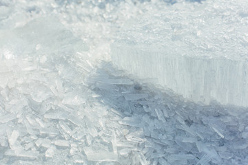 Amazing abstract broken ice crystals texture. Clear melting ice background.