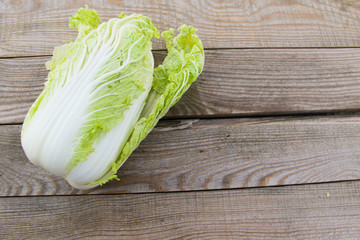 Whole chinese cabbage on rustic wooden table