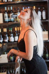 Female sommelier waiting wine for degustation in the party