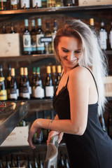 Female sommelier waiting wine for degustation in the party