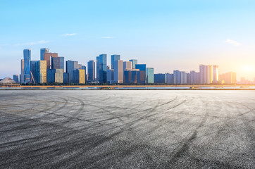 Empty asphalt square ground and Hangzhou business district cityscape
