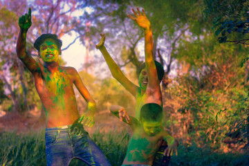 Two Indian child playing with the color in holi festival