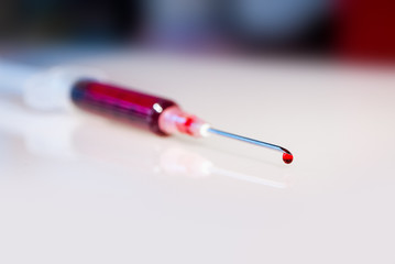 Syringe needle with blood macro view