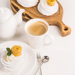 Light festive pavlova dessert made from meringue, lemon kurt and whipped cream