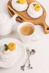 Light festive pavlova dessert made from meringue, lemon kurt and whipped cream