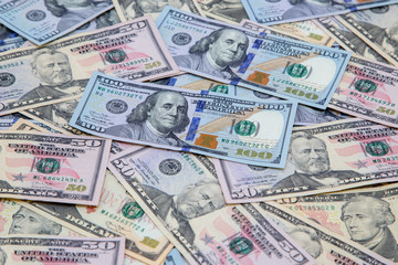 Background of dollar bills. American Dollars Cash Money. One hundred dollars, fifty dollars, ten dollars Banknotes. Hundred Bucks.