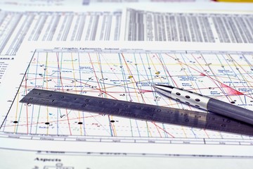 Astrological forecast. Ruler and pencil on the background of Astrological graphic ephemeris,...