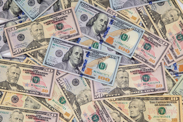 Background of dollar bills. American Dollars Cash Money. One hundred dollars, fifty dollars, ten dollars Banknotes. Hundred Bucks.