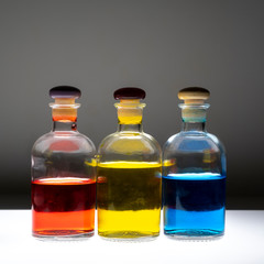 Bottles with colored liquid