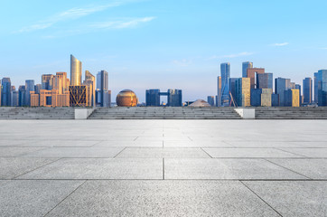 Empty square floor and Hangzhou city skyline with buildings